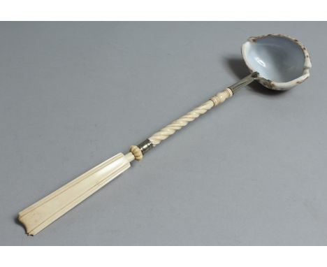 A COWIE SHELL PUNCH LADLE with ivory handle. 14ins long.