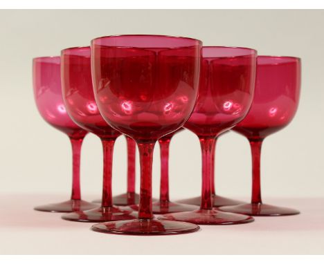 A SET OF EIGHT CRANBERRY WINE GOBLETS. 4.5ins high.