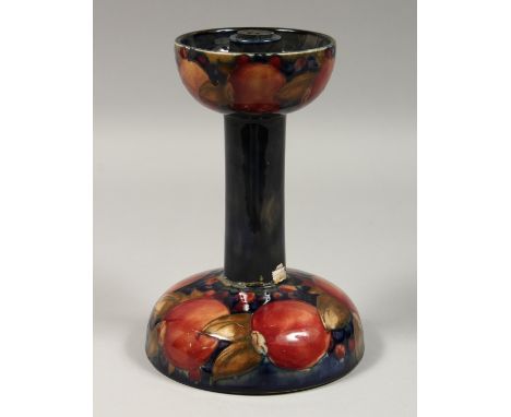 A MOORCROFT LIBERTYS POMMEGRANATE CANDLESTICK, impressed Moorcroft, with paper label. 8ins high (AF).