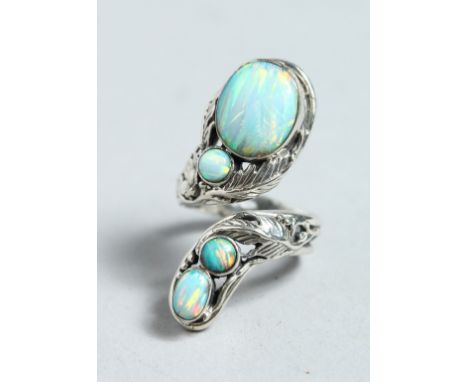 A SILVER AND NATURALISTIC OPAL SET RING.