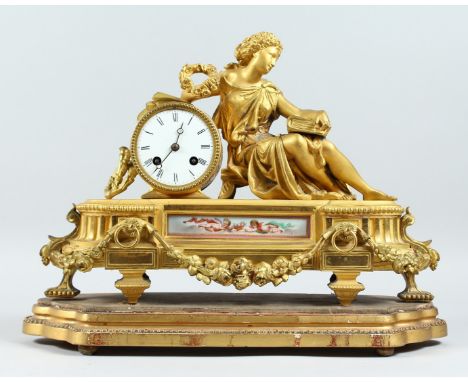 A 19TH  FRENCH CENTURY ORMOLU MANTLE CLOCK, with eight day movement striking on a bell, the case with a reclining female figu