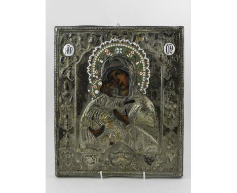 A Russian white metal icon, having enamel decoration. H. 32cm W. 27cm