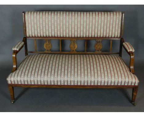 A Sheraton Revival mahogany and rosewood two seater settee, boxwood and ivory inlaid, having a foliate tapestry woven striped