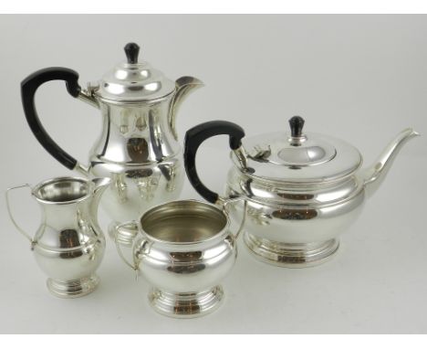 Garrard & Co. Ltd, 112 Regent Street. A four piece silver plated tea service of waisted baluster form, mounted black phenolic