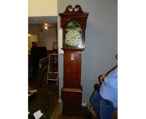 A late George III oak long case clock, the case with broken swan neck pediment above a broken arch glazed hood and shaped tru