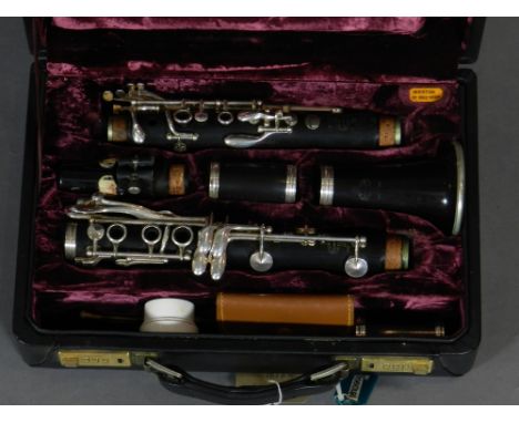 Buffet, Paris. A cased white metal mounted clarinet, number 335377.