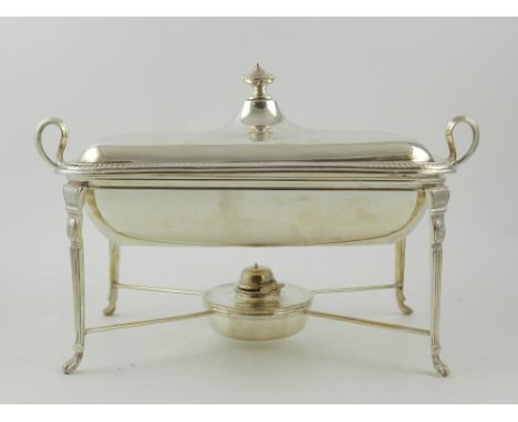 Goldsmiths and Silversmiths Company, 112 Regents Street, London. An Edwardian Sheraton Revival silver chafing dish and cover,