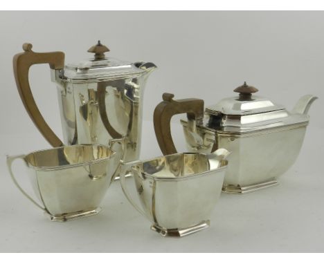 A George III style three piece silver tea service, comprising tea pot, cream jug and sugar bowl, hallmarked Sheffield, 1942, 