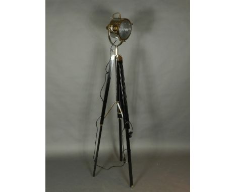 A chrome plated and ebonised search light 'standard lamp'. H.185cm