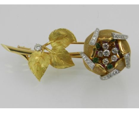 An unusual yellow metal, diamond, ruby, and emerald set floral brooch, the five articulated diamond edged petals surrounding 