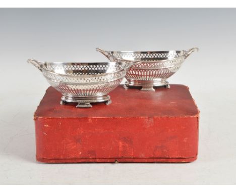 A pair of Edwardian silver oval-shaped twin handled baskets, Glasgow, 1914, makers mark of R&W Sorley, in original fitted cas