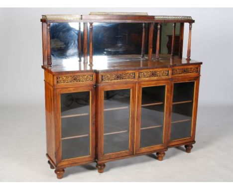 A 19th century Regency style rosewood and gilt metal mounted breakfront mirror back chiffonier, the open shelf supported by f