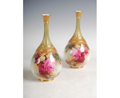 A pair of Royal Worcester hand painted bottle vases decorated by W. Harbron, dated 1912, with colourful rose and foliate deco