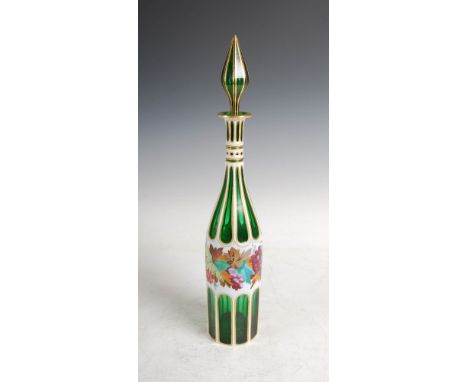 A late 19th century Bohemian green and opaque white glass overlaid decanter and stopper, decorated with a central frieze of c