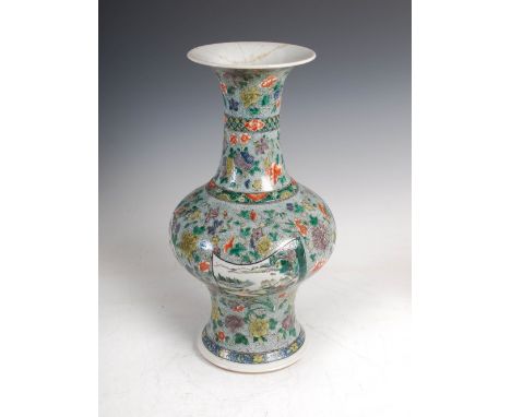 A Chinese porcelain famille verte vase, Qing Dynasty bearing Kangxi six character mark but later, decorated with four shaped 