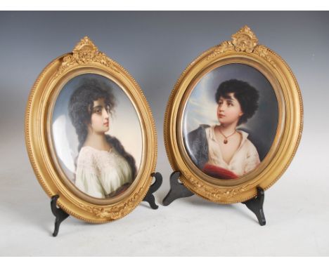 A pair of late 19th century KPM porcelain portrait panels, one decorated with a girl wearing lace fringed blouse, 26cm x 21cm