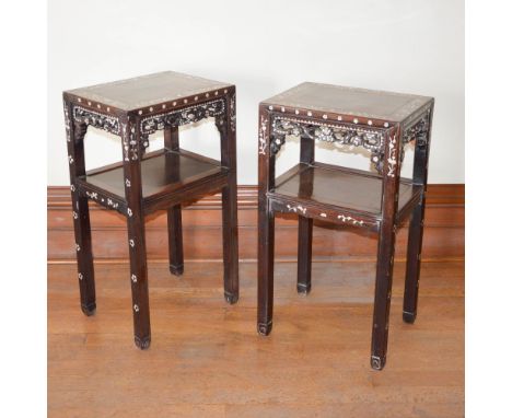 A pair of Chinese dark wood and mother of pearl inlaid jardiniere stands, Qing Dynasty, the rectangular panelled tops within 