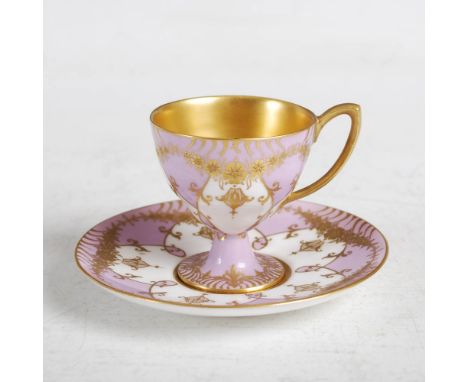A Royal Worcester lilac ground coffee cup and saucer, dated 1916 and 1917, with richly gilded foliate details, puce printed m