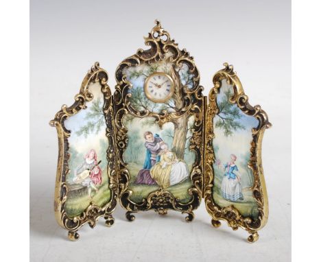 A French ormolu and enamel timepiece in the form of a three fold screen, the centre panel with circular dial bearing Roman nu