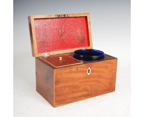 A George III mahogany and boxwood lined tea caddy, the hinged cover with white metal octagonal shaped handle, opening to a fi