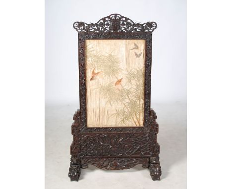 A 19th century Chinese dark wood and silk work screen, the detachable upper panel set with a silk work panel depicting bamboo