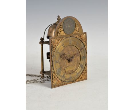 An 18th century lantern clock with dial inscribed 'Jonathan Lowndes in ye Pall Mall', bearing date '1680', the 6" brass dial 