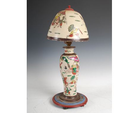 A Chinese porcelain crackle glazed vase converted to a table lamp, late Qing Dynasty, decorated with warriors on horseback, w