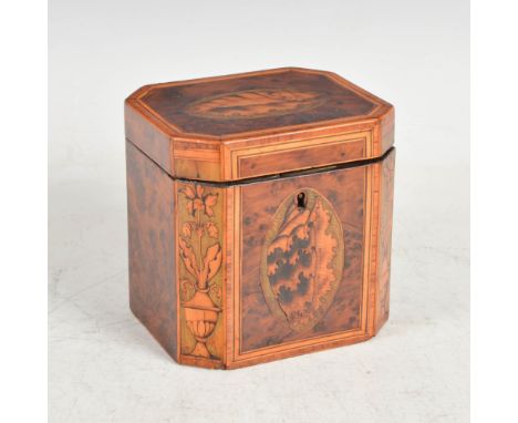 A George III burr walnut, boxwood lined and marquetry inlaid octagonal shaped tea caddy, the hinged cover inlaid with a conch