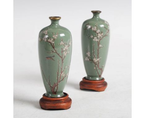 A pair of Japanese miniature green ground silver wire work cloisonne vases, Meiji Period, each decorated with a single bird a