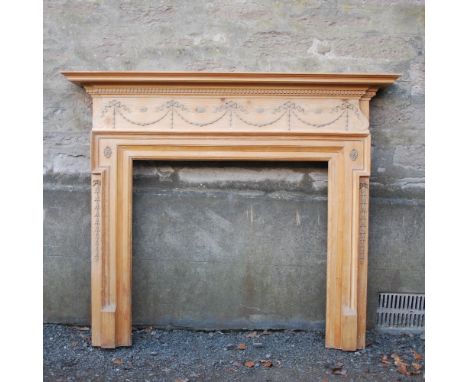 A late 19th/ early 20th century pine and gesso fire surround in the George III style, overall size 177cm wide x 147cm high, i