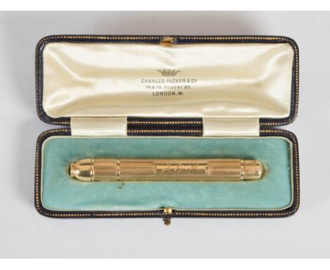 A 9ct gold Patent propelling pencil by S. Mordan & Co., engraved with initial panel 'J.G.H.' on an engine turned ground, in f