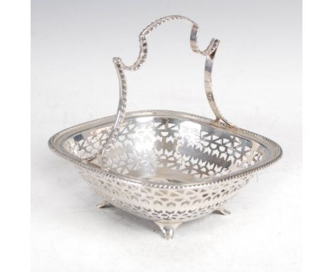 A George V silver basket, Sheffield, 1927, makers mark of M.H.& Co. Ld., of rounded rectangular form with shaped handle, foli