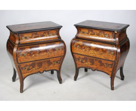 A pair of 19th century Italian ebonised and marquetry inlaid commodes emblematic of hunting, the rectangular tops inlaid with