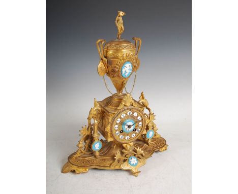 A late 19th century French ormolu and opaline glass mounted mantle clock, the circular dial with individual Roman numerals, t