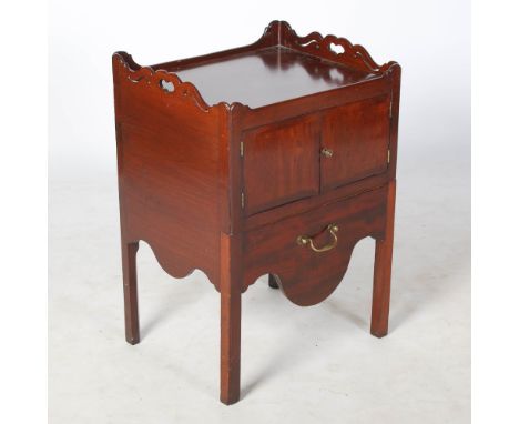 A 19th century mahogany tray top commode, the rectangular top with a raised gallery edge and heart-shaped cut outs, above a p
