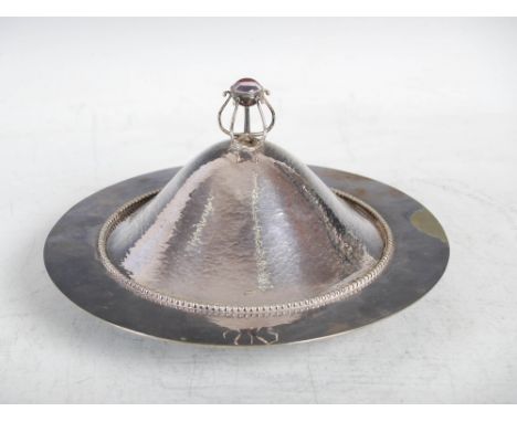 C. R. Ashbee for the Guild of Handicraft, a silver plated muffin dish and cover, with hammered finish and open wirework finia