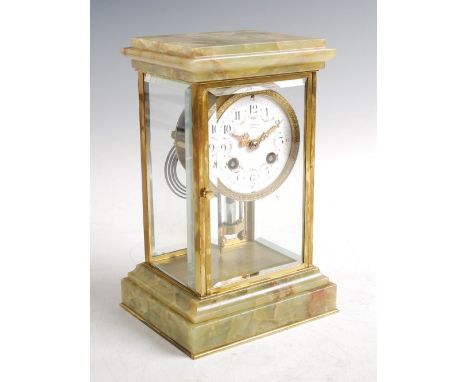 An Edwardian onyx and gilt metal mantle clock, the dial signed BROOK & SON, EDINBURGH, the white circular enamel dial with Ar