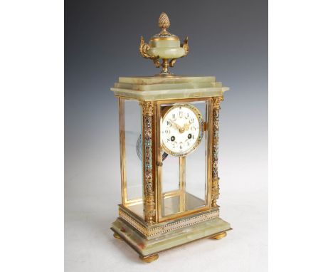 An early 20th century onyx and champleve enamel mantle clock, the circular dial with Arabic numerals and floral garland decor