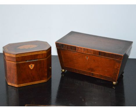 A George III mahogany and chequer banded octagonal shaped tea caddy, the hinged cover inlaid with oval panel of conch shell, 