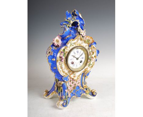 A late 19th century French porcelain blue ground mantle clock in the Rococo style, the slightly convex enamel dial with Arabi