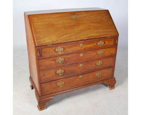 A George III mahogany bureau, the rectangular top above a fall front opening to a fitted interior of pigeon holes, small draw