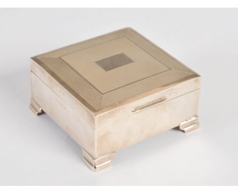 A mid 20th century silver box, Birmingham, 1967, makers mark of FH, with engine turned detail, raised on four bracket feet, 8