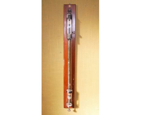 An early 20th century stick barometer, BAIRD & TATLOCK, with silvered dial and adjustable vernier, mounted on a rectangular m