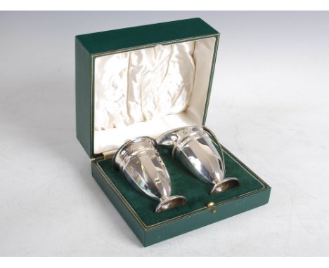 A George VI silver sugar caster and cream jug in original fitted case, Sheffield, 1938, makers mark of R&B, of tapered facete