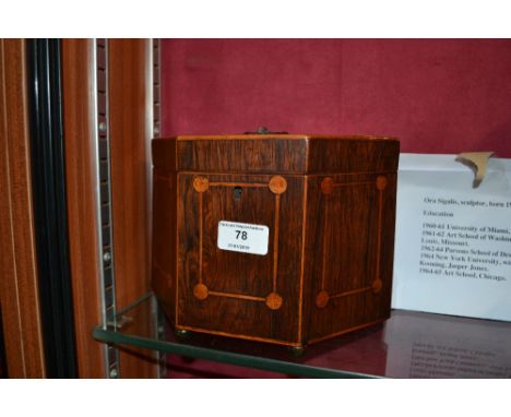 An early 19th Century rosewood and inlaid tea caddy 