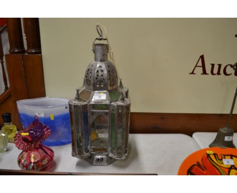 A Turkish style metal and stained glass candle lantern