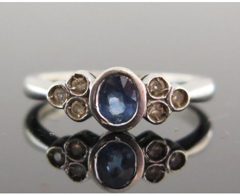 A 9ct White Gold, Sapphire and Diamond Ring, 4.5x4mm central stone, continental marks, size K.5, 2.48g 