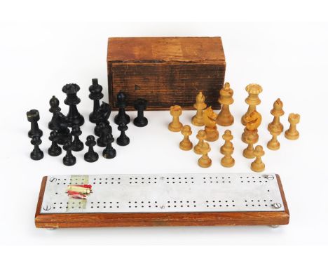 A boxwood and ebonised Staunton pattern chess set, the king 7.5cm high, the pawn 4cm high, together with a stainless steel an