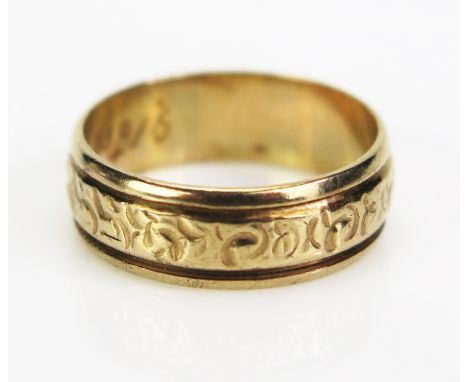 A 9ct Gold Wedding Band with foliate patternation, hallmarked, 6mm wide, size K.5, 2.86g 