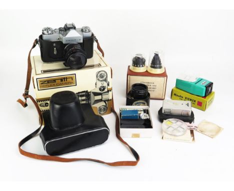 A Zenith B 35mm SLR camera, together with assorted camera accessories. 
